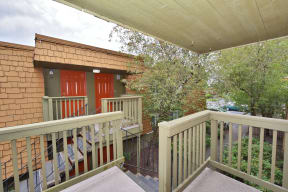 the deck of the home has views of the city and the trees