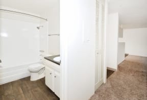 an empty bathroom with a toilet and a sink