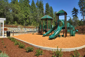 Brunswick Commons Exterior a playground with two slides and a jungle gym