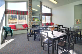 a dining room with tables and chairs