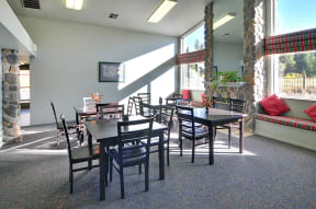 a dining room with tables and chairs