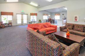 a living room with couches and chairs