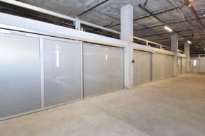 a row of stainless steel doors in a warehouse