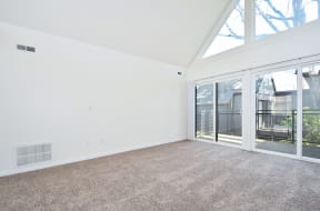 Timberwood Beaverton:  a living room with white walls and carpet