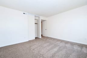 Timberwood Beaverton:  a bedroom with a carpeted floor and white walls