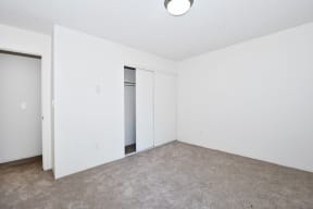 Menlo Manor:  bedroom with a carpeted floor and white walls