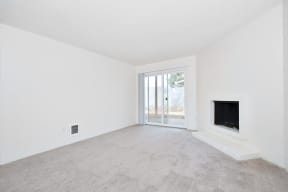 Menlo Manor:  living room with a fireplace and a patio door