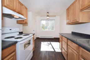 Crescent Ridge kitchen with wood cabinets and white appliances
