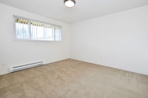 The Firs: bedroom with a carpeted floor and a window
