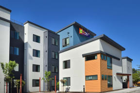 a picture of the front of a building with a blue sky in the background