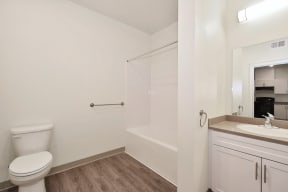 a bathroom with a toilet sink and bathtub