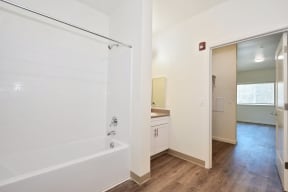 a bathroom with a shower and a sink in a 555 waverly unit