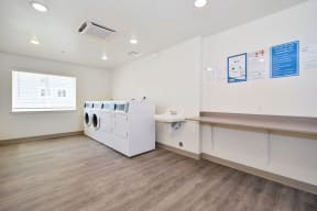 a laundry room with a washer and dryer