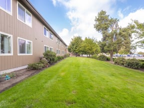 a large green lawn in front of a building