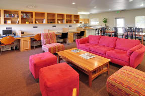 a living room with a couch chairs and a coffee table