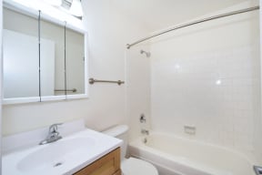 a bathroom with a sink toilet and bathtub