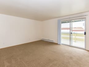 Willow Creek:  a bedroom with a sliding glass door and beige carpet