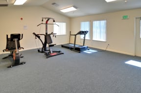 a fitness room with exercise equipment