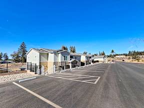a parking lot with houses on the side of a road