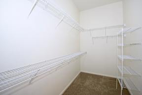 Empty white shelving in a room.