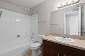a bathroom with a sink toilet and a tub