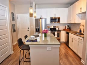 Gourmet Pointe at Lake CrabTree Kitchen With Island in Morrisville Apartments