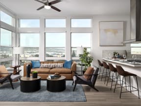 a living room with a couch and chairs and a kitchen with a table and chairs