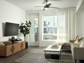 a living room with a couch and a table and a television