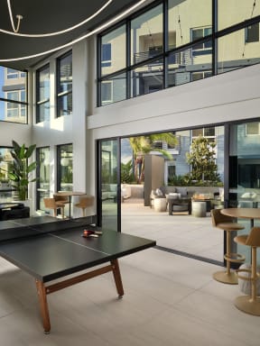 a ping pong table in a lobby of a building