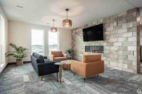Lobby with tv, couches and windows located at Deforest Yards in DeForest, WI