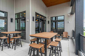 Sky Lounge with tables and chairs located at Deforest Yards in DeForest, WI