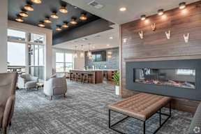 Sky lounge with fire place and bar area located at Deforest Yards in DeForest, WI