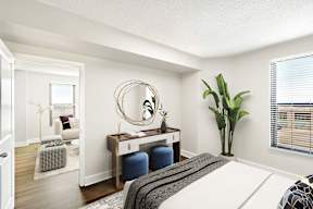 A bedroom with a bed and vanity