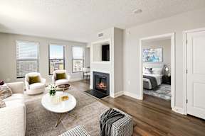 A living room with a fireplace and a couch