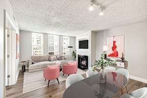 A living room with a table and chairs