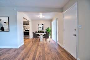 Dining room with a table and chairs.