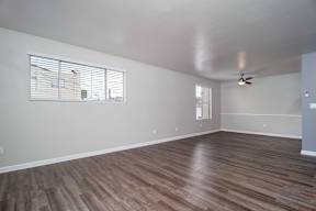 Carpeted Lounge Area with Ceiling Fan at Los Robles Apartments, Pasadena