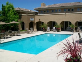 Apartments In Roseville - Gated Pool With Lounge Chair, Tables, Umbrellas, And Near The Club House