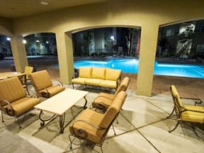 Seating by pool l The Villas at Villaggio Apartments in Modesto CA 
