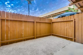 Fenced patio at SpringTree Apartments 