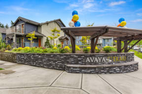 Avaya Trails Wall with Logo, Cement Path, Apartment Exteriors, Greenery and Baloons