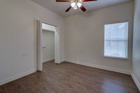 Spacious bedroom at Legend of Lindale, designed for 55+ senior living comfort