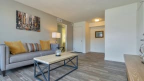 a living room with a couch and a coffee table at Spring Meadow Apartments, Glendale, Arizona