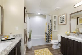 a bathroom with a white toilet next to a bath tub
