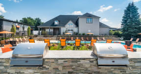 poolside grilling stations outside Axis at Westmont Apartments
