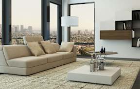 a living room filled with furniture and a large window