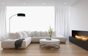 a white living room with a white couch and a white coffee table