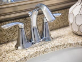 a sink with a faucet on top of it
