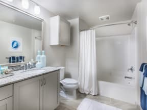 a bathroom with a toilet sink and bathtub
