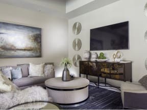 a living room filled with furniture and a flat screen tv
